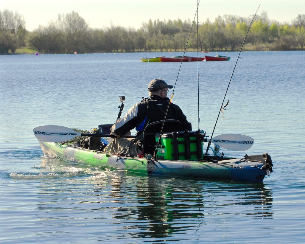 man in an inflatable fishing kayak